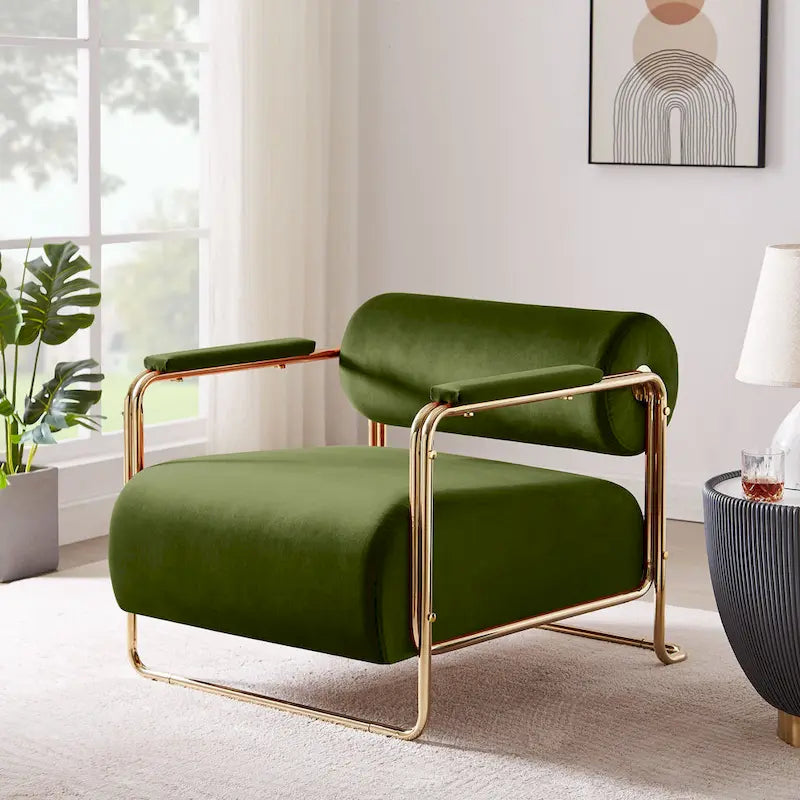 Sillón ancho de terciopelo con respaldo cilíndrico y estructura metálica