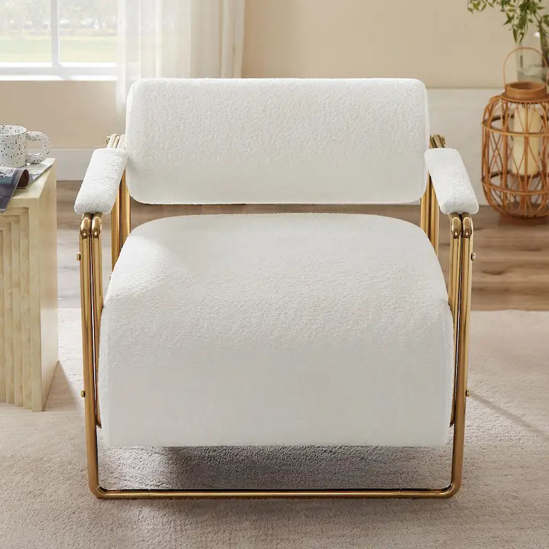 Sillón ancho de terciopelo con respaldo cilíndrico y estructura metálica