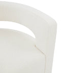 Sillón giratorio tapizado con respaldo calado