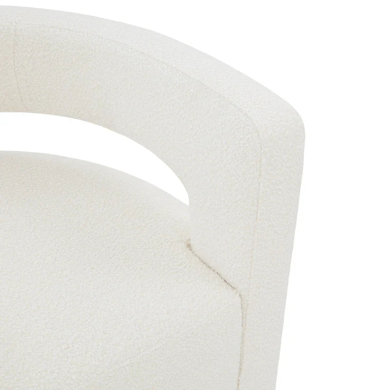 Sillón giratorio tapizado con respaldo calado