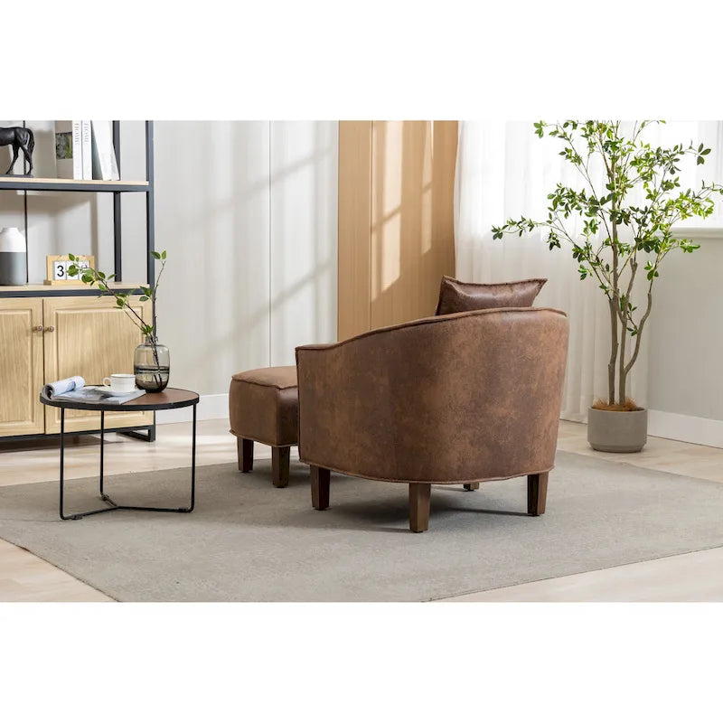 Sillón tapizado tipo barril con otomana