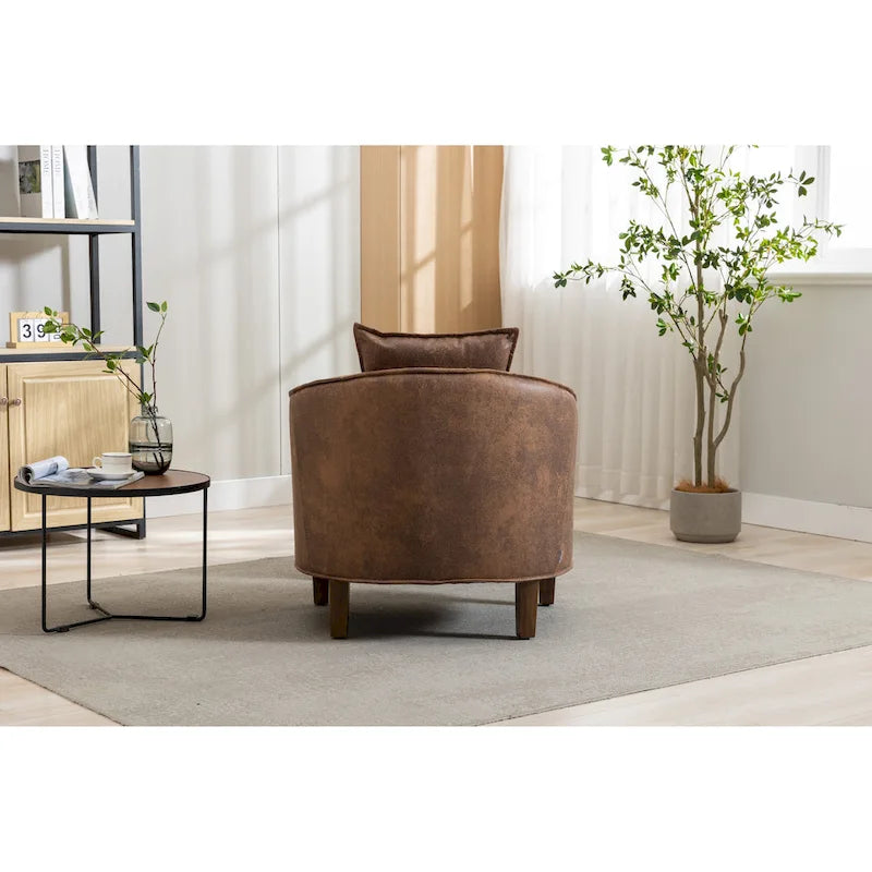 Sillón tapizado tipo barril con otomana