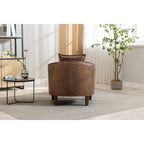Sillón tapizado tipo barril con otomana