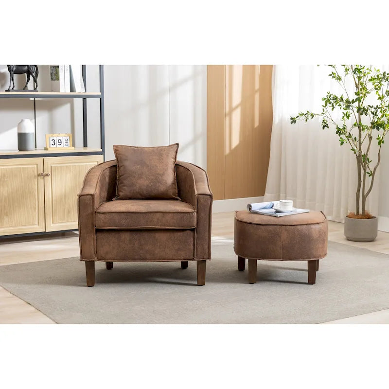 Sillón tapizado tipo barril con otomana