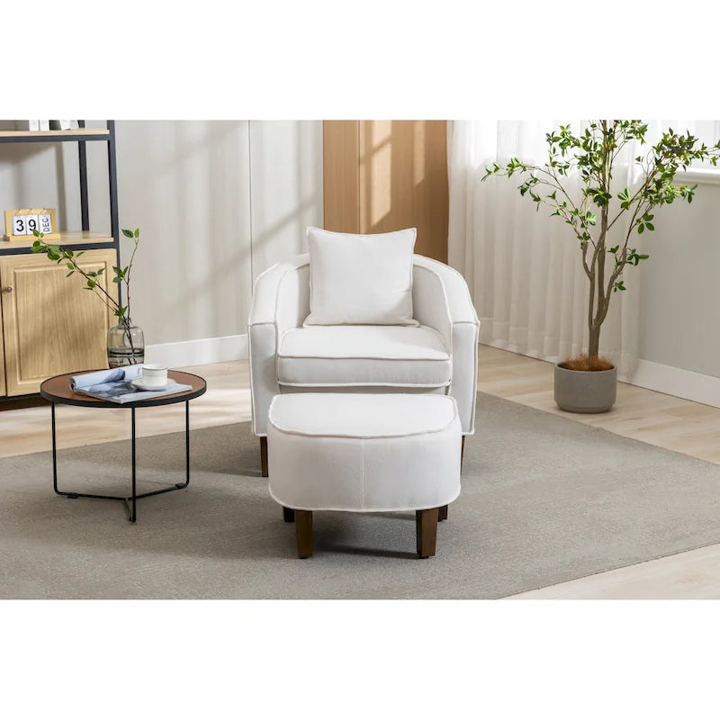 Sillón tapizado tipo barril con otomana