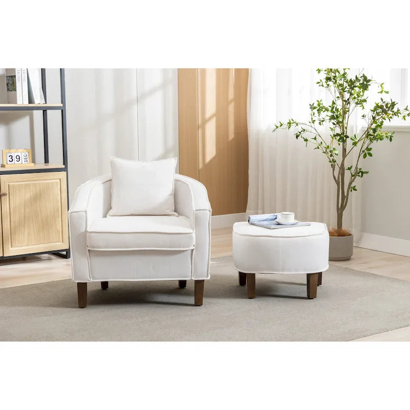 Sillón tapizado tipo barril con otomana