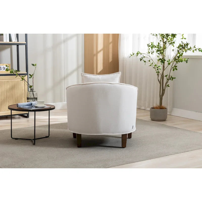 Sillón tapizado tipo barril con otomana