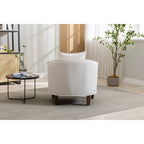 Sillón tapizado tipo barril con otomana