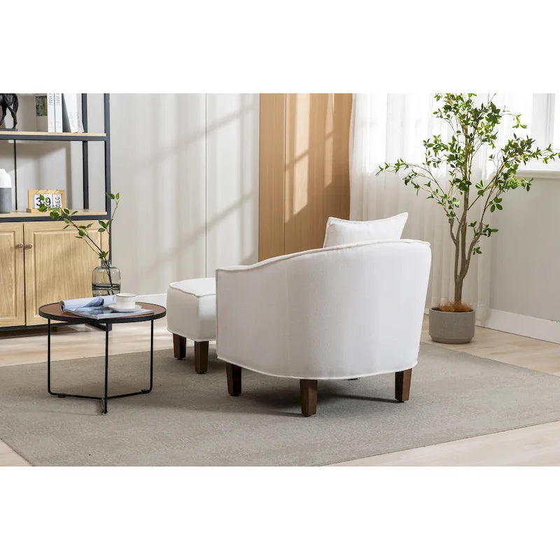 Sillón tapizado tipo barril con otomana
