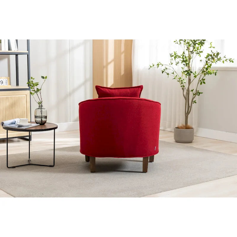 Sillón tapizado tipo barril con otomana