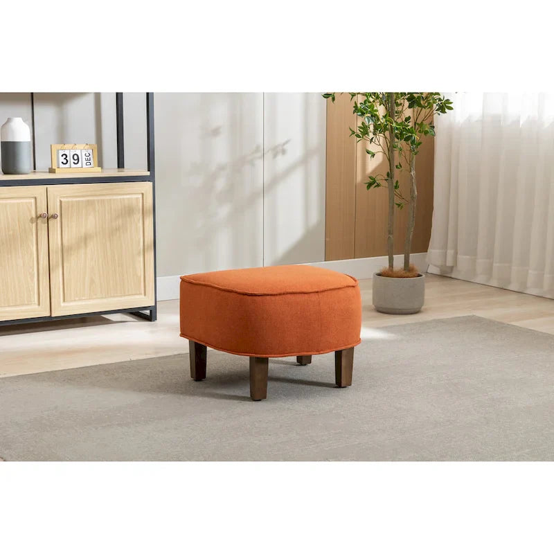 Sillón tapizado tipo barril con otomana