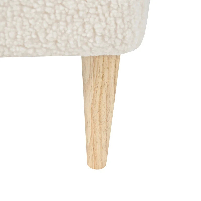 Puf cuadrado de bouclé con patas de madera